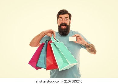 Payment method. day of sell out. man showing credit card. Very good offer. nice purchase. Big Sale online in our shop. ready to pay online. successful shopping. bearded man carry heavy shopping bags