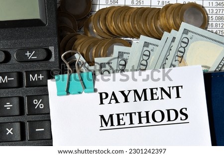 PAYMENT METHODS - words on a white sheet against the background of a calculator, banknotes and pennies. Business and finance concept