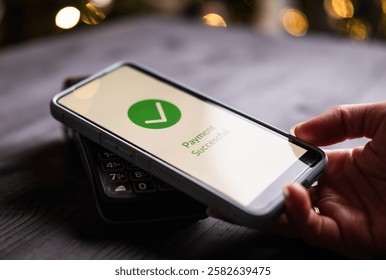 Payment Processed And Approved On A Wireless Terminal And Smartphone, With Approval Shown On A Screen