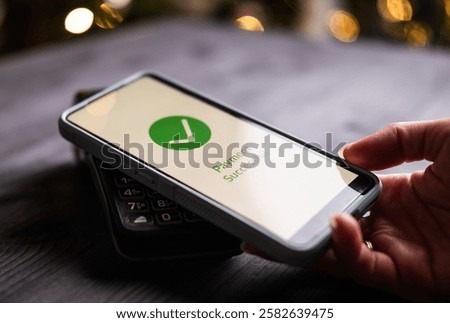 Payment Processed And Approved On A Wireless Terminal And Smartphone, With Approval Shown On A Screen