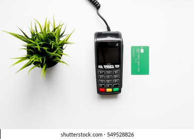 Payment Terminal With Card On White Background Top View