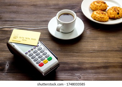 Payment Transactions. Terminal And Credit Card On Cafe Wooden Table Copy Space