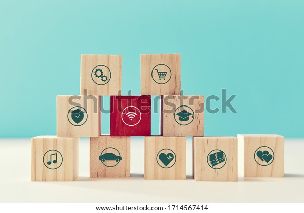 Payments\
on-line. Online services. Pyramid of wooden cubes, red block, wifi\
sign. Trolley cap, heart, car, notes\
signs