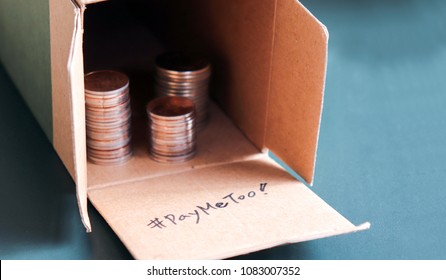 #PayMeToo As A New Campaign To Close The Wage Gap Between Men And Women. An Open Pile Of Paper Boxes And Coins.