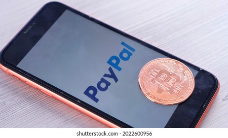 PayPal Logo On The Screen Smartphone With Bitcoin Cryptocurrency: Moscow, Russia - May 31, 2021.