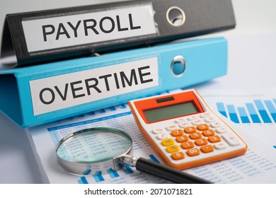 Payroll, Overtime. Binder data finance report business with graph analysis in office. - Shutterstock ID 2071071821