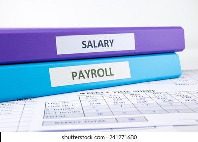 PAYROLL And SALARY Word On Binder Place On Weekly Time Sheet Documents, Human Resources Concept