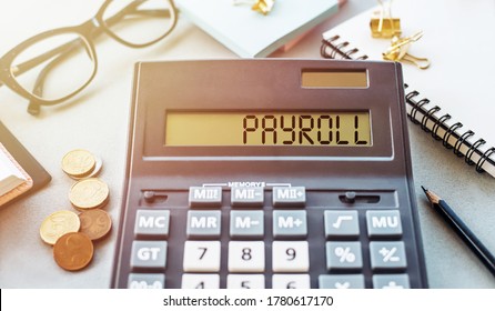 Payroll Word Written On Calculator. Business And Financial Concept