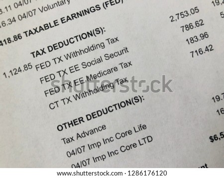 Paystub showing tax deduction detail.