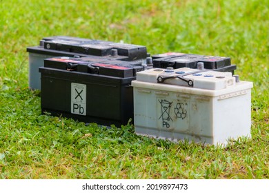 Pb Lead Car Batteries On A Grass In The Nature