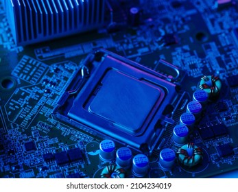 PC components - processor, motherboard. Macro photography. Blue lighting. Technological background. Electronics, network connectivity, cybersecurity.
