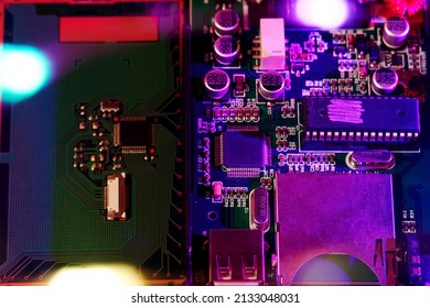 PCB and microchip and microprocessor backgrounds for quantum computing. Neon led lights. Technologies and IT