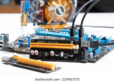 PCI-E Riser card for a GPU cryptocurrency mining rig. PCI-E Riser card is an expansion card used to extend a slot for computer mainboard.