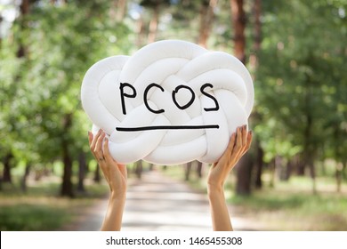 PCOS - Polycystic Ovary Syndrome, Woman Sickness Lettering On White Background In Womans Hands