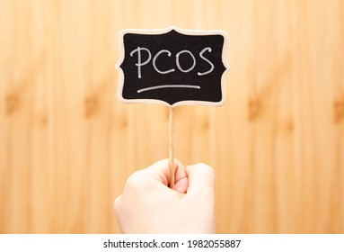 PCOS - Polycystic Ovary Syndrome, Woman Hormone Sickness Lettering On Blackboard In Woman's Hand