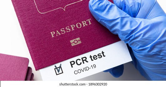PCR Test And Travel Concept, Mark Of COVID-19 PCR Testing In Tourist Passport. Diagnostics Of Corona Virus In Airport Due To Restrictions. International Tourism Hit By Coronavirus During Pandemic.