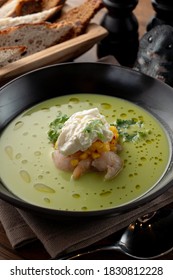 Pea And Corn Green Cream Soup With Shrimps And Expensive Cheese In A Fine Dining Restaurant, Close Up, Macro Texture