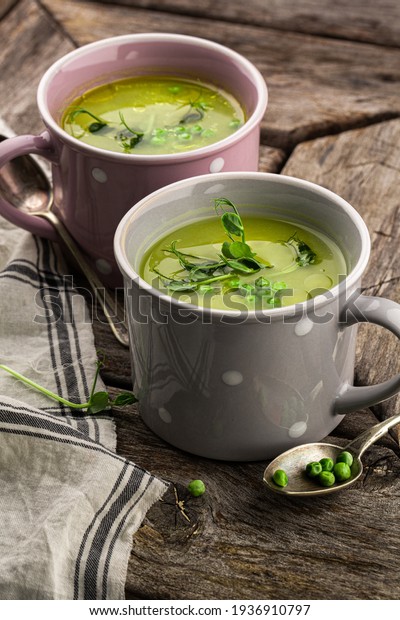 Pea cream soup. Green, vegetable\
soup. Interesting, unusual presentation,\
rustic