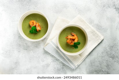 pea cream soup, with shrimp, green soup, homemade, top view, no people,