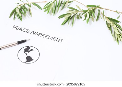 Peace Agreement Concept Metaphor With Olive Branch.Includes Copy Space.