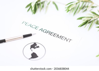 Peace Agreement Concept Metaphor With Olive Branch.Includes Copy Space.