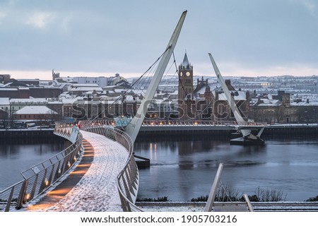 The Peace Bridge covered in snow in Derry, Northern Ireland