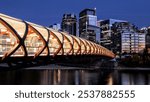 Peace Bridge at Night with Downtown Skyline, Calgary, Alberta, Canada