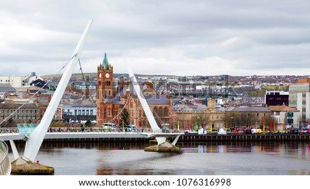 The Peace Bridge over the river Foyle and Guildhall, Derry/Londonderry, Northern Ireland. Birthplace of John Hume 