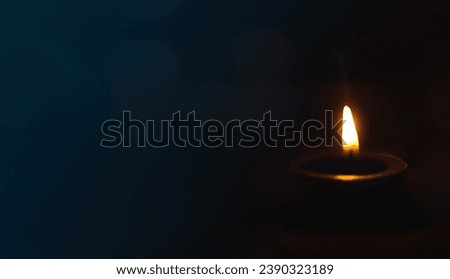 peace concept, Burning candle on dark table