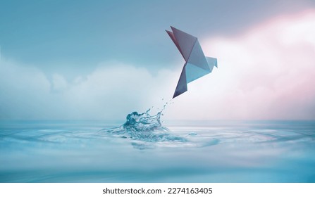 Peace concept. Conceptual photos to show the Freedom of White Origami Dove or Pigeon Flew from the Water into the Sky. International World Peace day, Human Rights, Love and Hope - Shutterstock ID 2274163405
