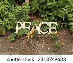 Peace decorative signage in a church front garden on Elgin Street in downtown Ottawa Ontario Canada.