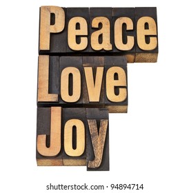 peace, love and joy - isolated words in vintage letterpress wood type