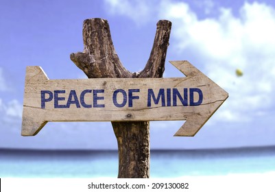 Peace Of Mind Wooden Sign With A Beach On Background 