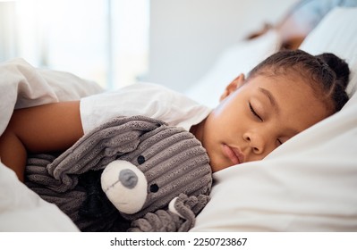 Peace, morning and wellness of black child sleeping in cozy bed with toy teddy in home on the weekend. Relax, sleep and health of kid dreaming in comfortable home bedroom with teddy bear. - Powered by Shutterstock