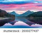 Peaceful autumn view on Obersee lake in Swiss Alps. Dramatic sunset sky and mountains reflections in clear water. Nafels village, Switzerland. Landscape photography