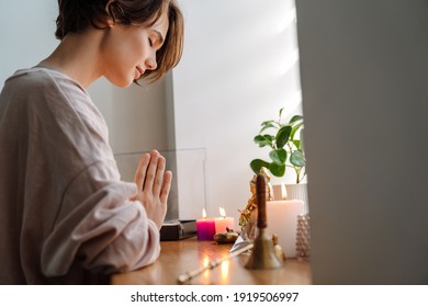 Peaceful Beautiful Girl Praying At Home Shrine Indoors