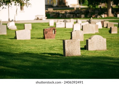 A Peaceful Day in the Historic Cemetery. Graveyard on a sunny day. Cemetery graveyard white and grey tombstones. Serenity Among the Tombstones on a Sunny Day