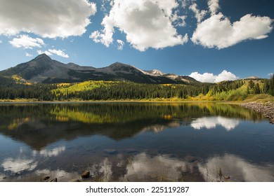 peaceful double dollar lake in colorado in autumn