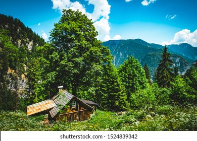 Peaceful Houses At The Foot Of The Alpine Mountains. Building Off The Grid. Home Sweet Home.