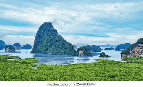 Peaceful idyllic panorama landscape of sea coastline with green forest, blue sea water and misty rocky islands against dark cloudy rainy sky at natural thailand tourist scenic destination for relax - Powered by Shutterstock