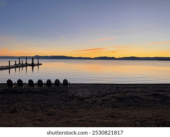 Peaceful lakeside sunset with empty chairs facing a calm pier, reflecting the soft glow of twilight over the water. - Powered by Shutterstock