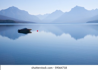 Peaceful landscape of  a power boat moored in the water - Powered by Shutterstock