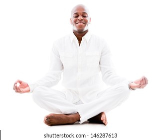 Peaceful Man Doing Yoga And Meditating - Isolated Over A White Background