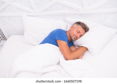 Peaceful Mature Man Relaxing. Good Sleep Is Reachable Dream. World Sleep Day. Benefits Of Good And Healthy Sleep. Breathe Easily, Sleep Well. Handsome Man In Bed. Sleeping Guy At Home. Need More Rest.