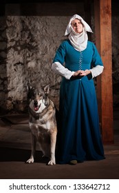 Peaceful Medieval Nun Standing With Pet Dog