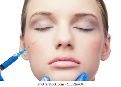 Peaceful Pretty Model On White Background Having An Injection On The Cheek