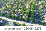 Peaceful residential street in Riverbend North neighborhood row of upscale suburban houses with swimming pools in West Plano, urban sprawl suburbs Dallas Fort Worth metroplex, Texas, aerial view. USA