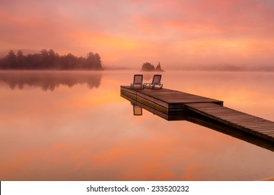 Peaceful scene by the lake on a beautiful foggy morning - Powered by Shutterstock