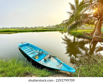 Peaceful scene of Vietnamese countryside.  There is a canoe in the shrimp pond in the morning - Shutterstock ID 2292799709