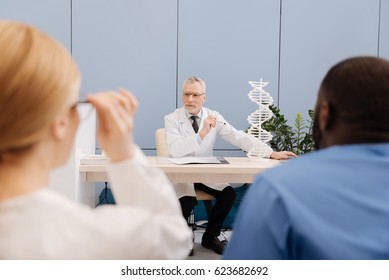 Peaceful Senior Doctor Conducting The Lecture In The Medical College